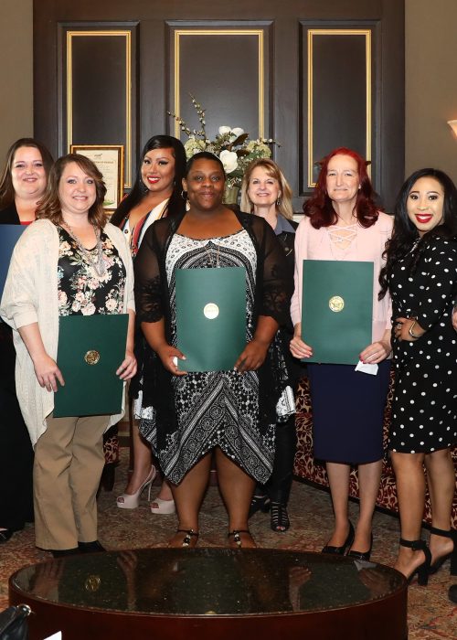 Representative Pittman among other elected officials presenting citations of congratulations to women who graduated from community programs in their districts.