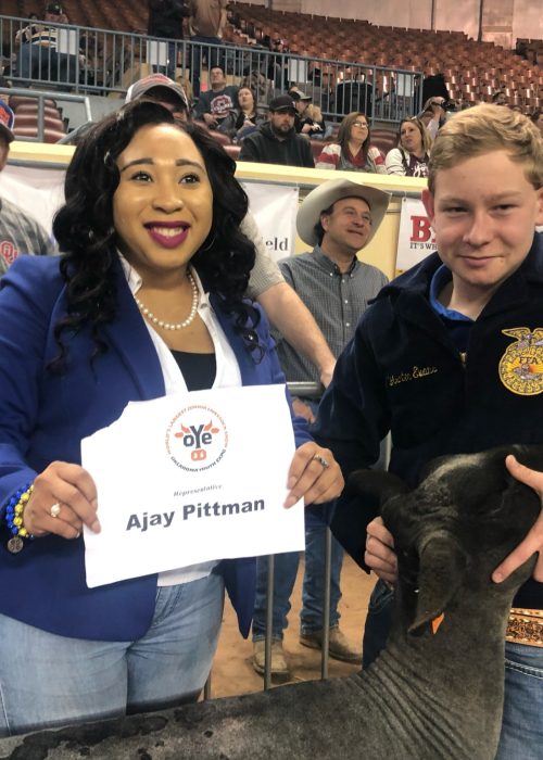 Representative Ajay Pittman attends the Oklahoma Youth Expo, which is the worlds largest junior livestock show. where she partners with a student to show a sheep.