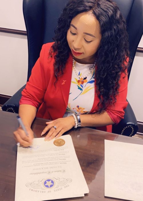 Rep. Ajay Pittman signing Graduation Citation for House District 99 students